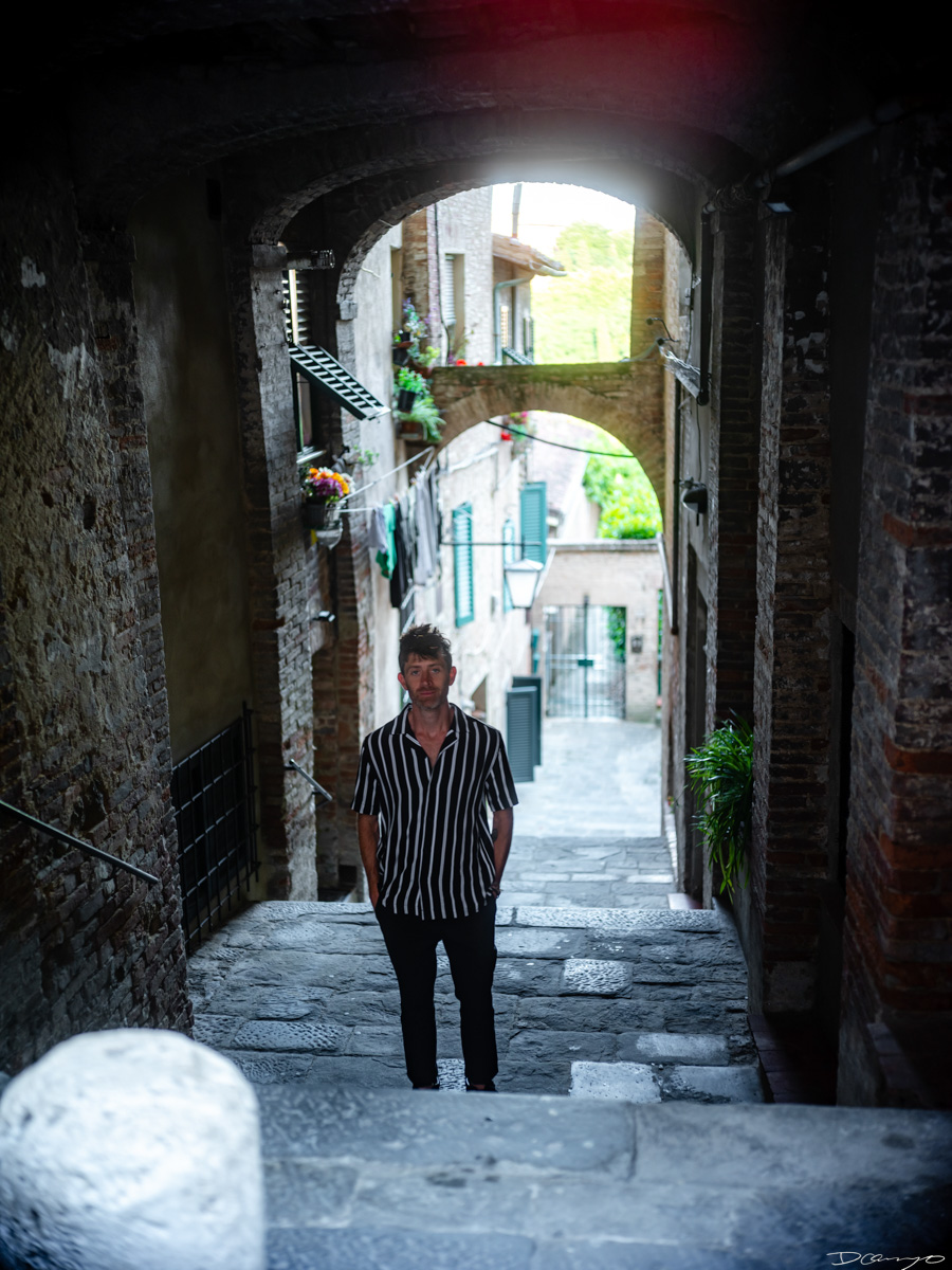 Photos from a trip through Italy in Summer of 2023. Locations include Rome, Florence, Tuscany, Castello di Bossi in Chianti, Siena, San Gimignano, Sirmione on Lake Garda, Bologna, Gudon, Italian Dolomites, Seceda, Cadini di Misurina, and Venice.